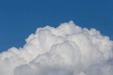 Naklejka na ściany i meble view on white fluffy clouds in a blue sky