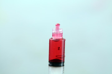 Man Hand with syringe full with red solution medicine. Medical Concept. Preparing medicine Procedure