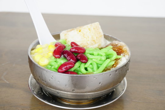 Cendol Desert. Asian favourite iced dessert of rice flour and pandanus jelly with coconut milk and palm sugar