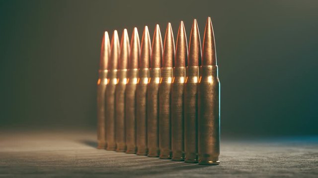 Row Of Standing .50 BMG Machine Gun Cartridges. New, Metallic Ammunition. 4K
