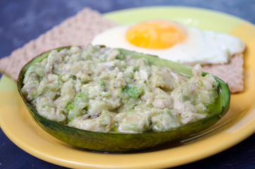 dish with avocado and egg for breakfast