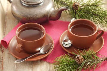 Pine tea in cups