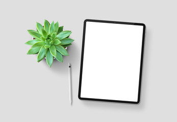 tablet with plant on blank table