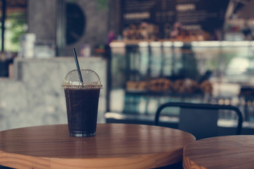 ice black coffee On a wooden table in the afternoon coffee shop