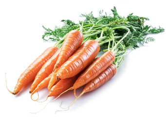 Fresh organic carrots isolated on white background.