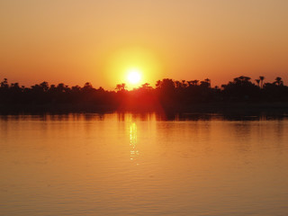Boat in Nile river during sunset in Luksor, Egypt