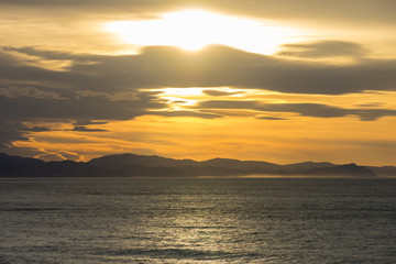 Clouds during golden sunset in basque country