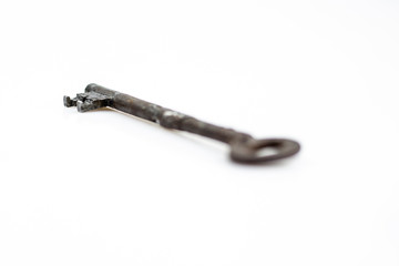 Old metal key with corrosion isolated on white background - Vintage rusty key