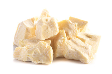 Chunks of Raw Organic Cocoa Butter on a White Background