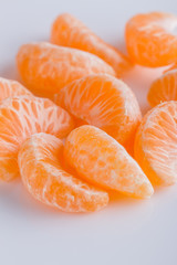 juicy mandarin on a white acrylic background