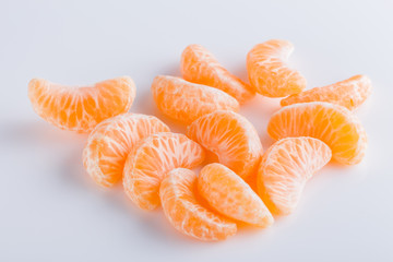 juicy mandarin on a white acrylic background