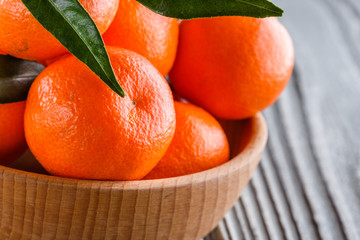 juicy mandarin on a gray wooden rustic background