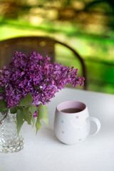 Bouquet of lilac in purple in glass vase