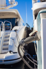Moored yachts charching with fuel and electricity
