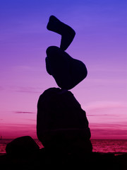 Balancing stones at sunset