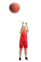 Female player shooting a basketball