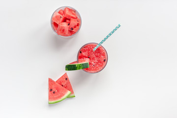 Watermelon smoothie with crushed fruits in glasses