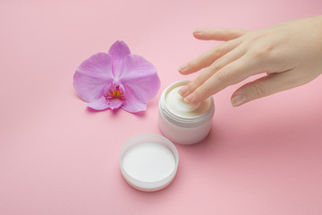 Obraz na płótnie Canvas Hand Skin Care. Beautiful Woman Hands With Natural Manicure Nails Applying Cosmetic Hand Cream On Soft Silky Healthy Skin. Mockup for natural women cosmetics.