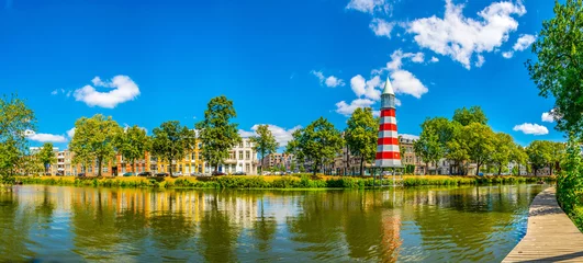 Fotobehang Lighthouse at the Valkenberg park at Breda, Netherlands © dudlajzov