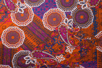 paisley pattern textiles red-brown color fabric texture