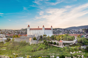 Fototapeta premium Beautiful view of the Bratislava castle on the banks of the Danube in the old town of Bratislava, Slovakia on a sunny summer day.