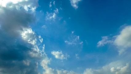 white clouds in the bright blue sky