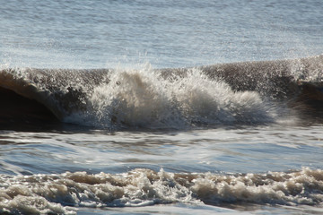 Ocean waves crashing onto the shore