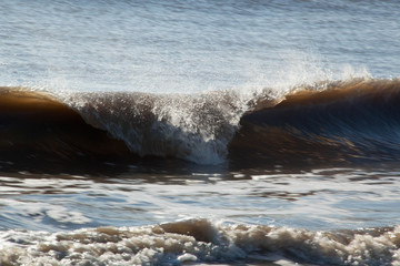 Ocean waves crashing onto the shore