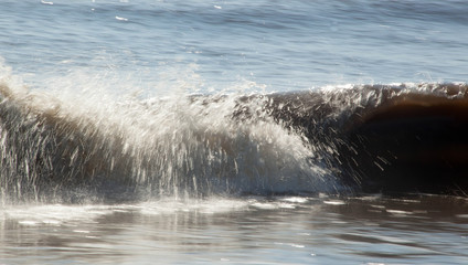 Ocean waves crashing onto the shore