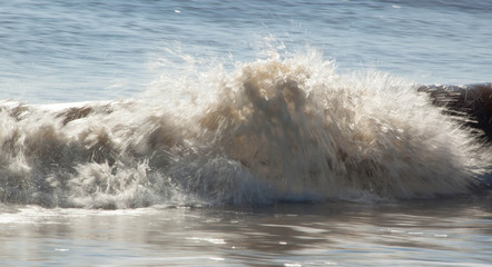 Ocean waves crashing onto the shore