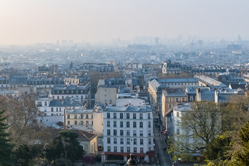Paris, panorama of the city, from Montmartre hill, typical roofs, in the mist