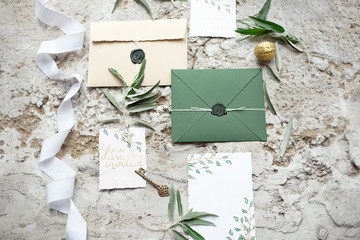 Wedding invitation as a decorated letter in an envelope in the style of boho