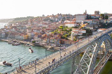 Fototapeta na wymiar Aerial view of Dom Luis I Bridge across Douro River, the famous postcard of Porto, Portugal