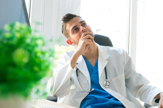 doctor in the consultation or clinic with thoughtful expression