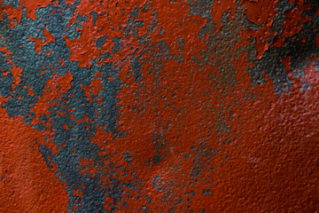 rough metal sheet with shabby red paint