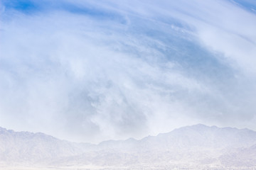 Obraz premium abstract nature winter foggy mountain silhouette in white clouds scenic cold highland morning landscape