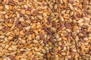 mix of roasted pistachio nuts cashew peanuts and almonds close up
