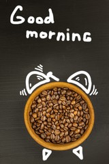 Fresh coffee and retro alarm clock. Concept of getting up to work. Morning awakening.