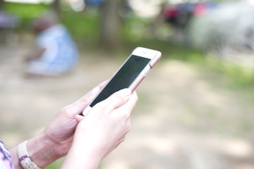 Business Woman conducts business correspondence on the phone for business meetings and negotiations on work.