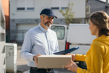 woman sending package over post express service