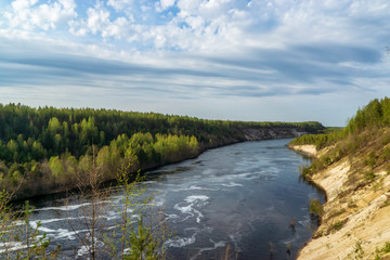 Fototapeta na wymiar Wild landscape of river in pine forest