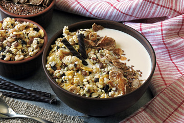 Healthy breakfast bowl with muesli, seeds and chocolate sticks. Sample breakfast for the figure and beauty.