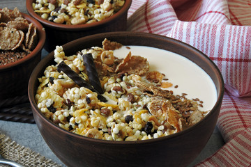 Healthy breakfast bowl with muesli, seeds and chocolate sticks. Sample breakfast for the figure and beauty.