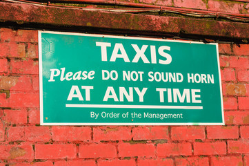 Sign "Taxis. Please do not sound horn at any time"