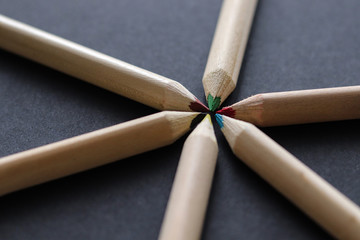 color pencils on black background