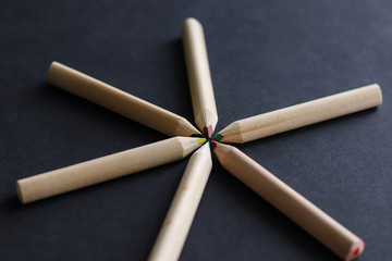 color pencils on black background