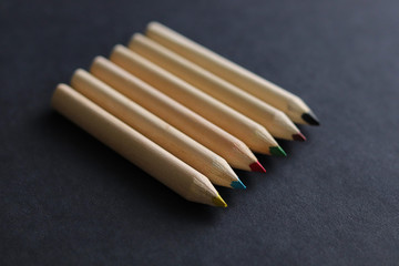 color pencils on black background