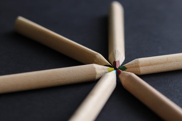 color pencils on black background