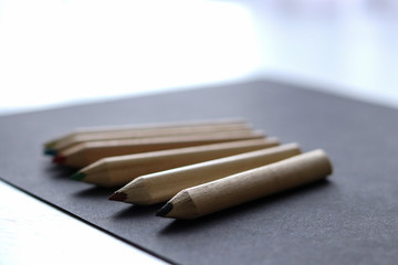 color pencils on black background