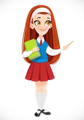 Cute redhaired schoolgirl holds book in her hand and points to the side with a pencil isolated on white background